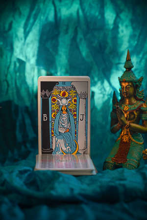 Defocused Mystical atmosphere, view of tarot card on the table, esoteric concept, fortune telling and predictions. Vertical, the Priestess. High quality photoのeditorial素材