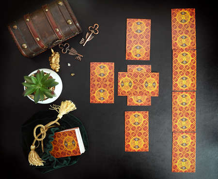 Tarot card reader arranges cards in a card spread.Fortune-telling on traditional tarot cards on the...
