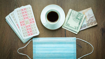 New Life composition with Tarot cards, face medical mask, money, cup of Coffee. ssia- January 2021: New Life composition with Tarot cards, face medical mask, money, cup of Coffee. ... High quality photoのeditorial素材