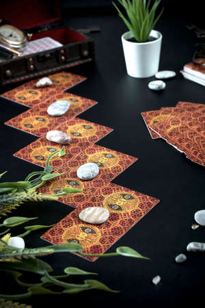 Tarot card reader arranges cards in a card spread.Fortune-telling on traditional tarot cards on the...