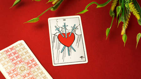 View of tarot card three of swords on the table. High quality photoのeditorial素材