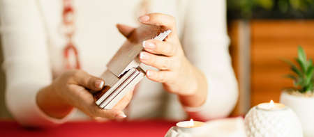 Selective Focus of two hands shuffling and adjusting tarot cards. High quality photoのeditorial素材