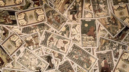 A pile of tarot trump cards jumbled, scattered and haphazardly arranged. ... High quality photo
