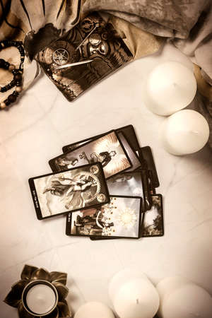 Tarot cards on fortune teller desk. Future reading and esoteric concept. Magic rituals. Mystical table with details. High quality photoのeditorial素材