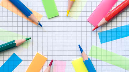 Multicolored stickers and paper clips on the blank checkered page. Education concept. High quality photoの写真素材