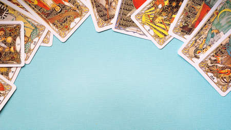 View of Golden tarot cards Frame on the Blue background, esoteric concept, fortune telling and predictions. High quality photoのeditorial素材