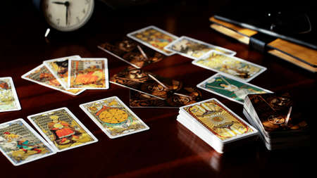 Blurred view of tarot card on the table, esoteric concept, fortune telling and predictions. High quality photoのeditorial素材