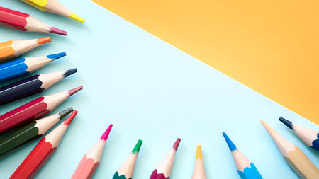 Pencils on empty sheet, blue and Orange tones. High quality photoの写真素材