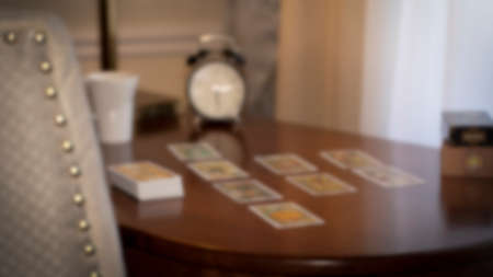Blurred view of tarot card on the table, esoteric concept, fortune telling and predictions. High quality photoのeditorial素材