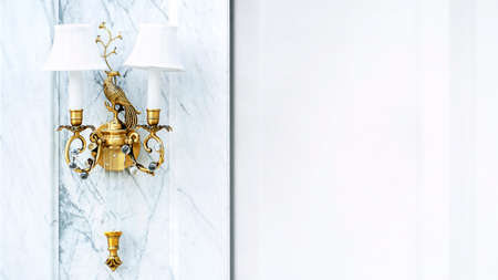 Blurred white gold wall lamp hanging on white wall with place for text. High quality photo
