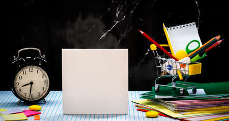 Blurred education and back to school concept. stationery over checkered Gray background. High...