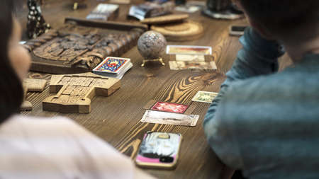 Tarot card reader arranges cards in a card spread. Fortune-telling on traditional tarot cards on the...