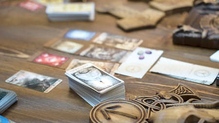 Tarot card reader arranges cards in a card spread. Fortune-telling on traditional tarot cards on the table. Selective focus, Moscow, Russia-June 2021.のeditorial素材
