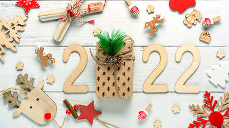 Christmas composition made of Christmas decoration and 2022 numbers on White background. Minimal concept of Xmas and New Year. High quality photoの写真素材
