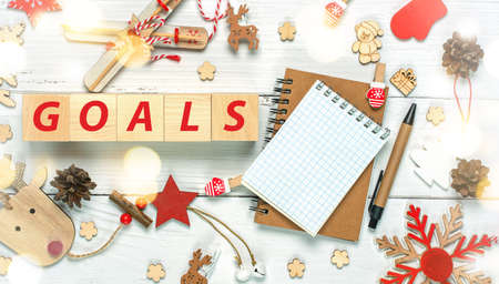 Christmas composition made of Christmas decoration and text goals on White background. Creative concept of Xmas and New Year. High quality photoの写真素材