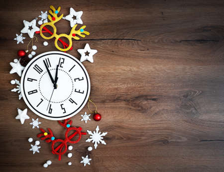 Christmas composition mad of Christmas decoration on Brown wooden background. Top view, flat lay....