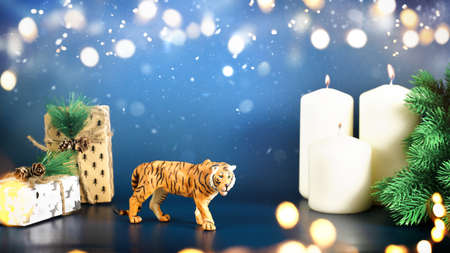 Banner for Christmas and New Year Christmas tree, snowflakes, on blue background, tiger symbol Chinese zodiac calendar. High quality photoの写真素材