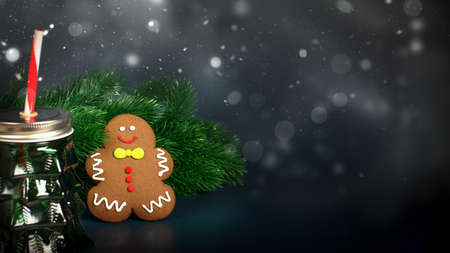 Blurred Christmas decoration with tree branches and gingerbread man on Blue background. New Year concept. High quality photoの写真素材