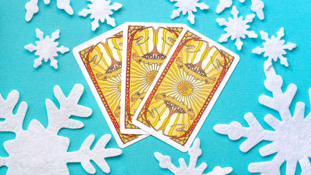 Tarot cards in Christmas decoration. Esoteric concept, fortune telling and predictions, Moscow, Russia-July 2021. High quality photoのeditorial素材