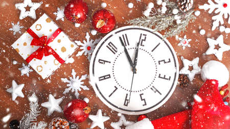 Christmas composition mad of Christmas decoration on Brown wooden background. Top view, flat lay....