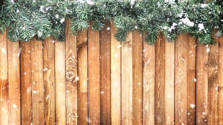 Blurred wooden winter background with branches of a christmas tree. High quality photo