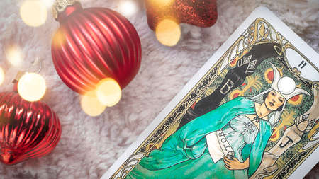 Tarot cards in Christmas decoration. Esoteric concept, fortune telling and predictions, Moscow, Russia-July 2021. High quality photoのeditorial素材