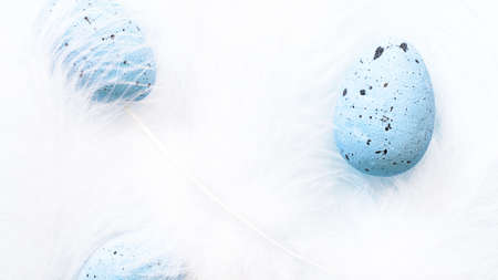 Blurred Easter composition with colorful Easter eggs in nest. Spring concept with copy space. high...