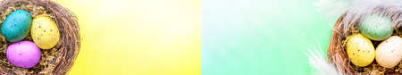 Blurred Easter composition with colorful Easter eggs in nest. Spring concept with copy space. high...