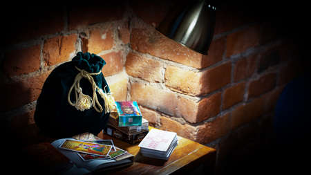Blurred predictions background. Tarot cards layout on witch table. Esoteric concept and astrology,...