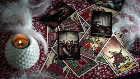 Blurred predictions background. Tarot cards layout on witch table. Esoteric concept and astrology, Fortune telling tarot. high quality photoのeditorial素材