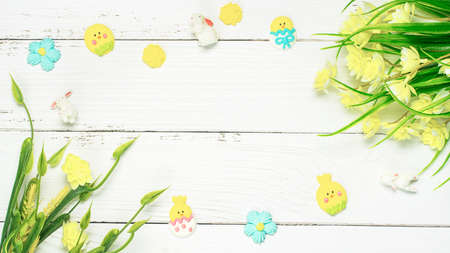 Colorful background with Easter eggs on white wooden board background. Happy Easter concept. Can be...
