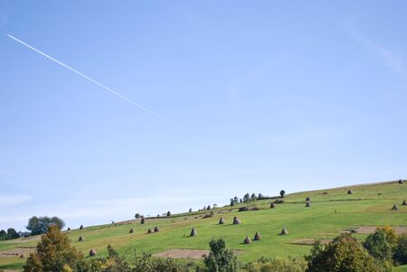 Purity of the sky with airplane's trackの写真素材
