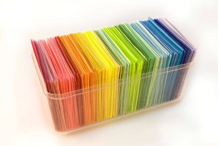 Various color shits of paper stack on white background