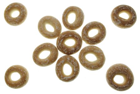 doughnut-shaped bread rolls with icing isolated on white background like a flower. traditional...