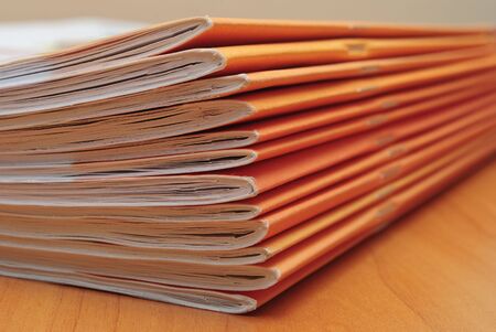 Stack of journals on office desktop. Shallow deep of fieldの写真素材