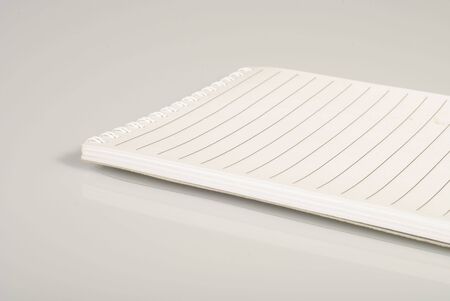 Notebook with white pages and thin lines for your copy text. Isolated