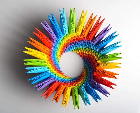 Colorfull origami 3d units like a rainbow circle isolated on white with shadow. From sheets of paper making modules, which joined.の写真素材