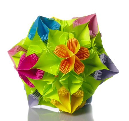 Colorfull origami kusudama from rainbow flowers isolated on white. 