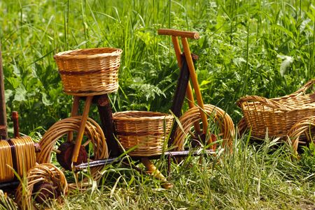 Basketry market on nature. Green field background. Decorative flowerpotの写真素材