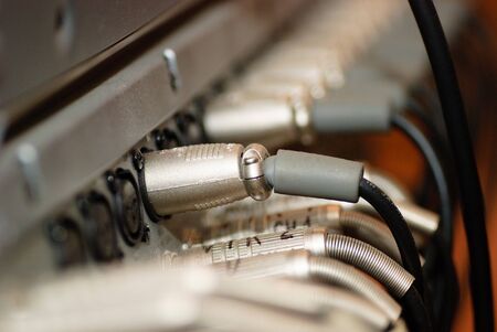 Video and sound cables on telestudio in plugs, blue tonedの写真素材