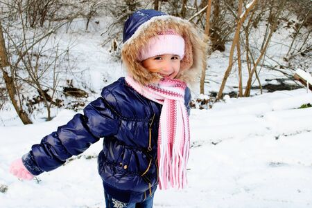 Girl outdoor are playing with snow outdoors