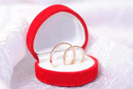 Wedding rings on white textile. Wedding postcardの写真素材