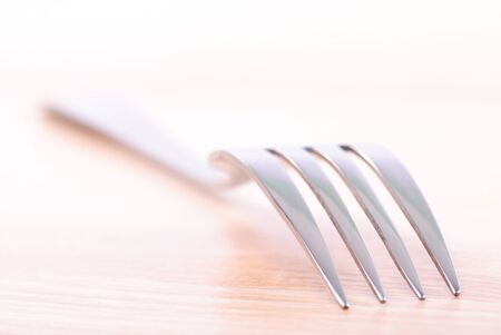 Fork on wooden table. Close up, selective focusの写真素材