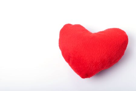 red fur heart on isolated on white backgroundの写真素材