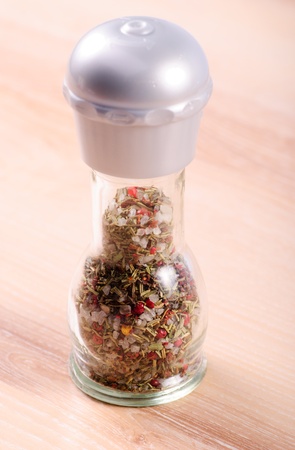 Mixed spicery mill on the wooden table in kitchenの写真素材