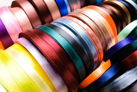 many-coloured ribbon spools in the craftの写真素材