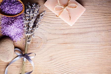 Lavender treatment soap, sea salt and stone on wooden table with copy spaceの写真素材