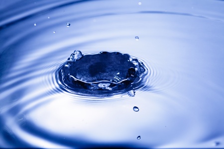 Blue water drop closeup, abstract background for pasting objects incideの写真素材