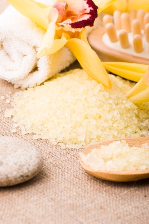 yellow bathing salt in the wooden spoon, spa conceptの写真素材