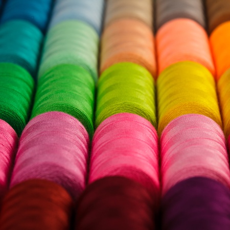Sewing threads multicolored background closeupの写真素材